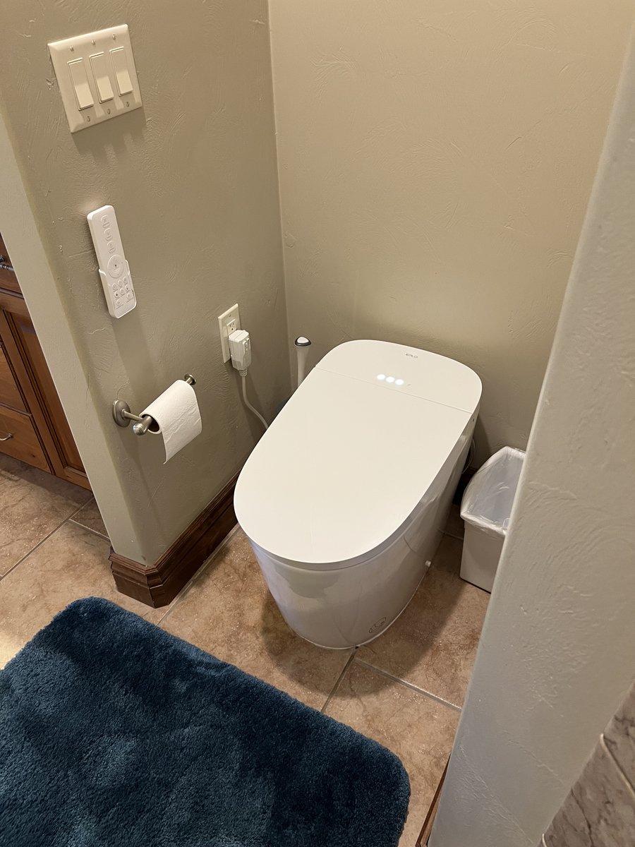 Bathroom after, new smart toilet installed by Pro Works